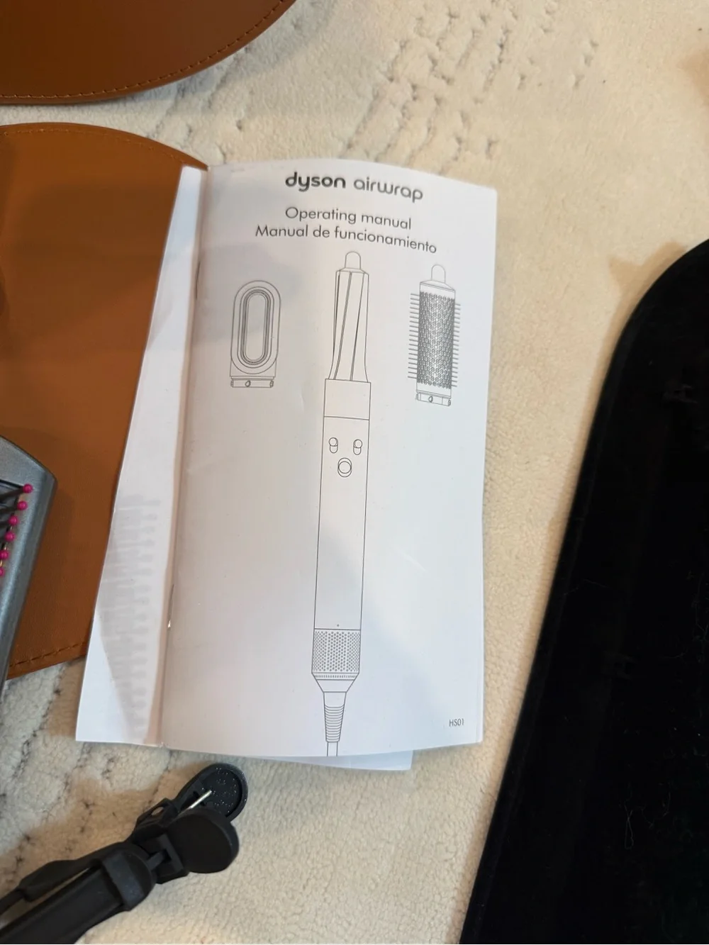 Dyson styling set in Pink and Gunmetal with Tan travel case